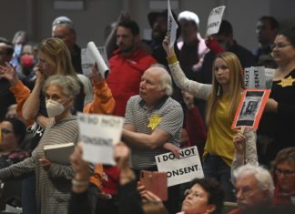 Anchorage mask mandate debate will extend into next week – Associated Press