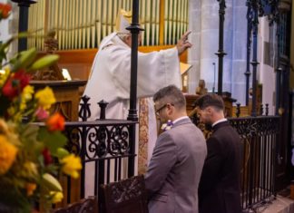 Gay priest and partner make Church in Wales history with same-sex blessing – PinkNews