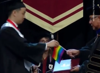 Students hand university president rainbow flags to protest ban on gay employees – LGBTQ Nation