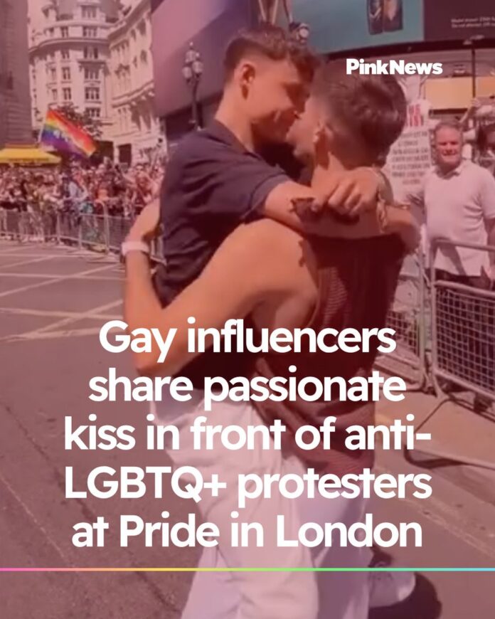 Gay influencers share passionate kiss in front of anti-LGBTQ+ protesters at Pride in London - PinkNews