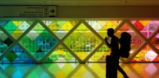 WATCH: This super gay airport has a sauna, drag performances & the fiercest runway entrance - Queerty