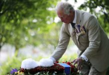 King Charles lays flowers at national memorial to LGBT armed forces veterans - The Guardian