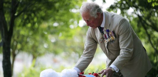 King Charles lays flowers at national memorial to LGBT armed forces veterans - The Guardian